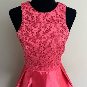 Monique Lhuillier coral formal dress.
